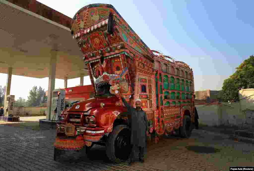 Before the printing of posters and banners became widespread, painted trucks, such as this one owned and operated by 45-year-old Amjad Khan, were a popular way of spreading campaign messages to the masses.