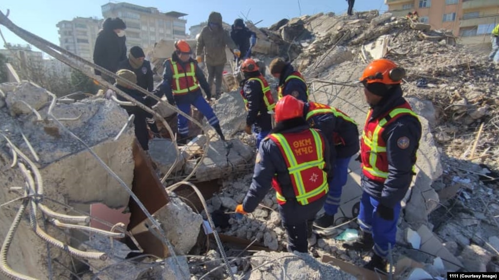 Rescuers search the rubble for survivors following a February 9 earthquake in Turkey.