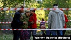 Жительница Киева у тела погибшей дочери
