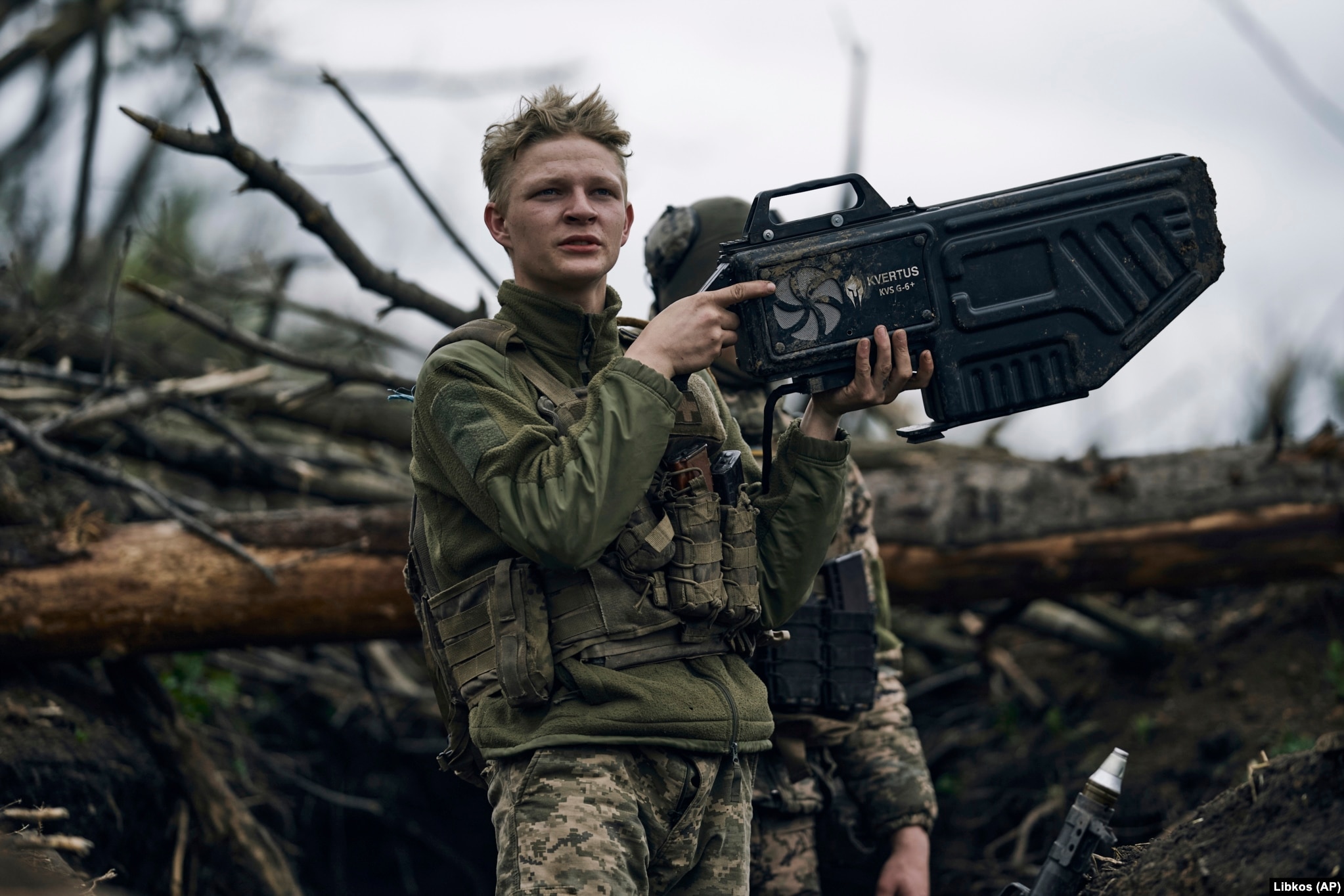 A Ukrainian soldier holds an anti-drone gun at a frontline position near Avdiyivka in April 2023. The $11,300 Ukrainian-made device seen in this image uses directed radio waves to overwhelm the connection between a drone and its operator. The interference can cut the drone’s video feed and, depending on the model of drone, can either force it to return to its takeoff point, land immediately, or drift away with the wind and eventually crash. 