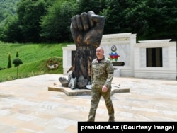 Ilham Aliyev at a newly built memorial to Azerbaijani troops in the Kelbadjar district in June 2022.