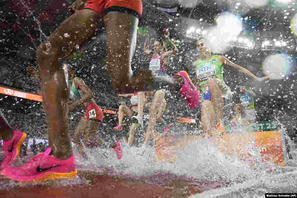 Athletes compete in the women&#39;s 3,000-meter steeplechase during the World Athletics Championships in Budapest.&nbsp;