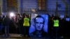 Demonstrators hold a portrait of Russian opposition leader Aleksei Navalny during a rally in front of the Russian Embassy in Warsaw on February 16. 