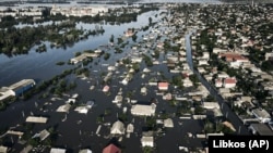 Затопленные улицы Херсона в результате разрушения плотины Каховской ГЭС, 7 июня 2023 года