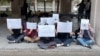  A group of female women students at Tehran University of Fine Arts faculty hold a protest on March 07.