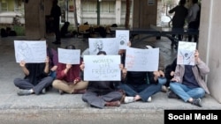  A group of female women students at Tehran University of Fine Arts faculty hold a protest on March 07.