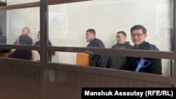 The activists appear in court in Almaty in February.