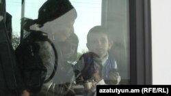 Ethnic Armenians from Nagorno-Karabakh arrive in Kornidzor, Armenia, on September 24.
