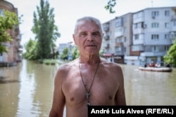 Volodymyr Barsak left his apartment after the first floor of the building was flooded.
