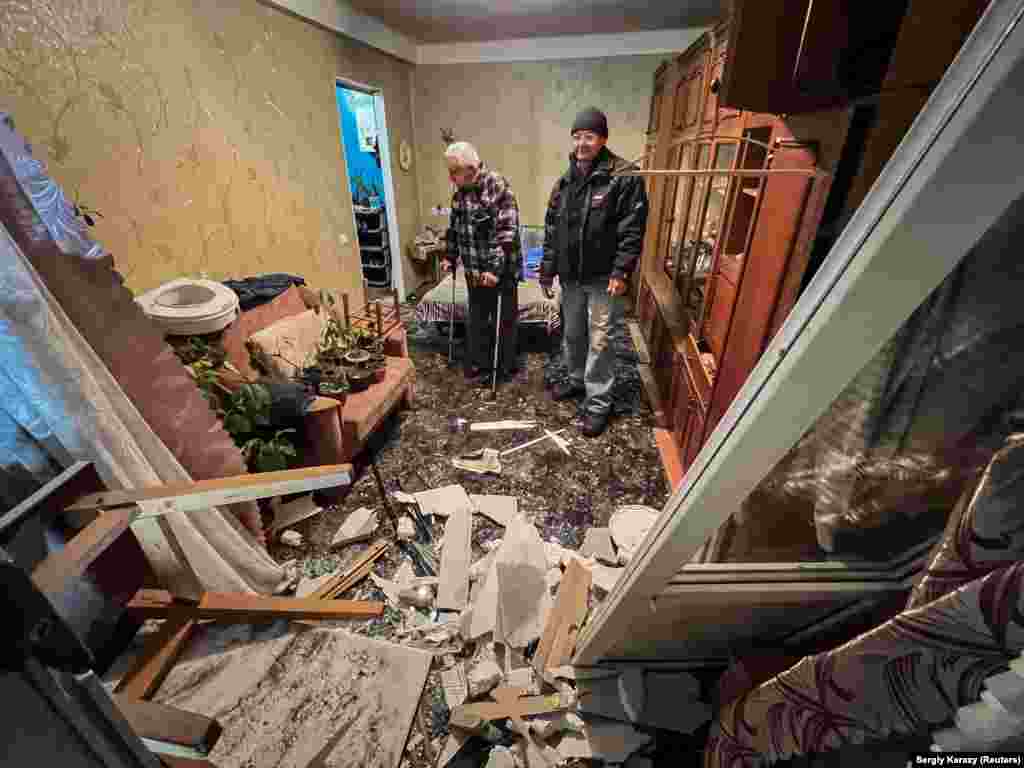 Petro Khomyn, 71, surveys the damage to his apartment. &nbsp;