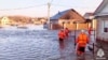 Rescuers evacuate residents from the flood-hit areas of Orsk on April 6.