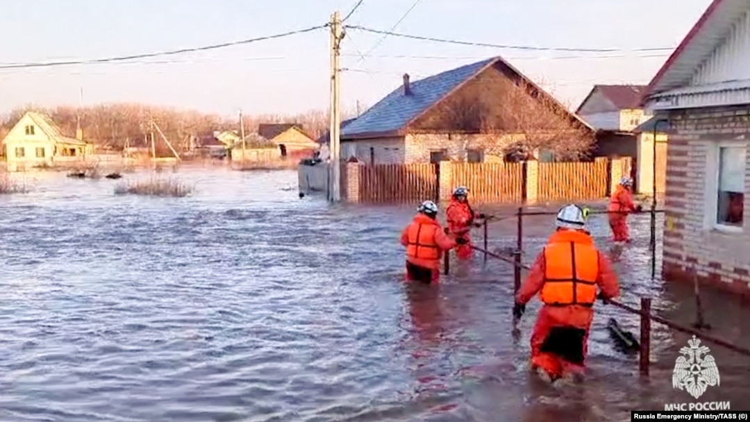 Rescuers evacuate residents from the flood-hit areas of Orsk on April 6.