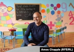 School principal Zohrab Maghakian in a classroom for preschoolers that was painted by teachers, parents, and students.