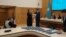 Татьяна Савельева ОСК басшысы Нұрлан Әбдіровтен депутат куәлігін алып тұр. Астана, 28 наурыз 2023 жыл. 
