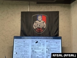 A flag in the training center depicting pro-Kremlin blogger Maksim Fomin, who was killed in a St. Petersburg cafe in April 2023.