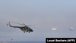 Российский вертолет Ми-28 у побережья сирийского города Тартус. 25 июля 2023 года