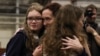 Alsu Kurmasheva (center) is greeted by her daughters at an airfield in San Antonio on August 2 following her release from Russian captivity the previous day. 