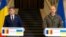 Romanian Prime Minister Marcel Ciolacu (left) and Ukrainian Prime Minister Denys Shmyhal address a press conference in Kyiv on October 19.