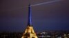 Айфеловата кула в Париж беше осветена в синьо-жълтите цветове на украинския флаг в навечерието на годишнината от началото на войната на Русия
