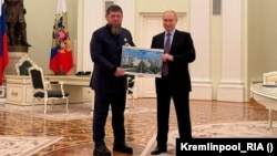Ramzan Kadyrov (left) and Vladimir Putin during their reported Kremlin meeting on May 22