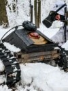 A Russian soldier tests a ground drone in Ukraine's Donetsk region in February. 