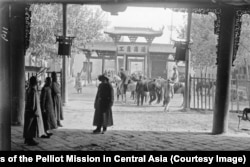 Members of the expedition ride on horseback in Kashgar, western China.