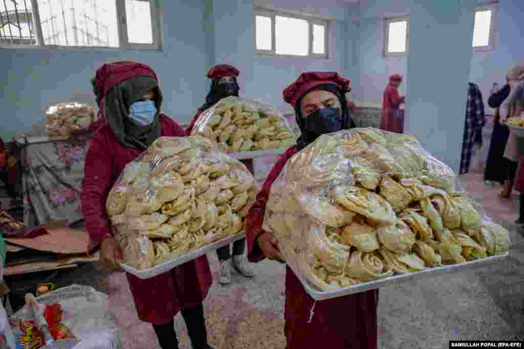 Afghan women prepare snacks at a factory in Kabul.