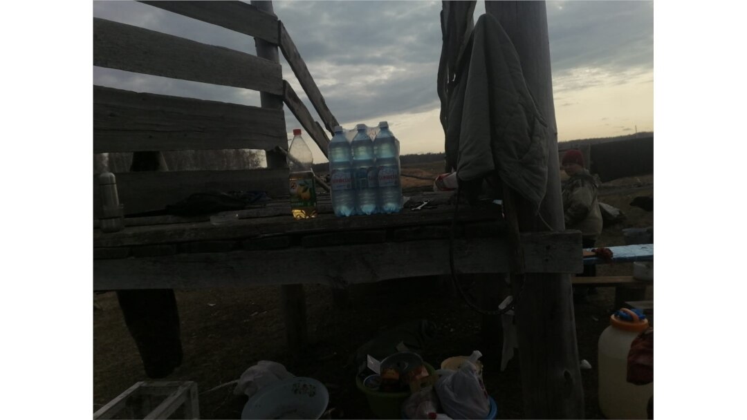 Drinking water and other essentials are brought to the makeshift encampment.