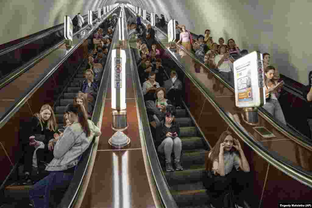 People take cover in a subway station during a Russian rocket attack on Kyiv.&nbsp;