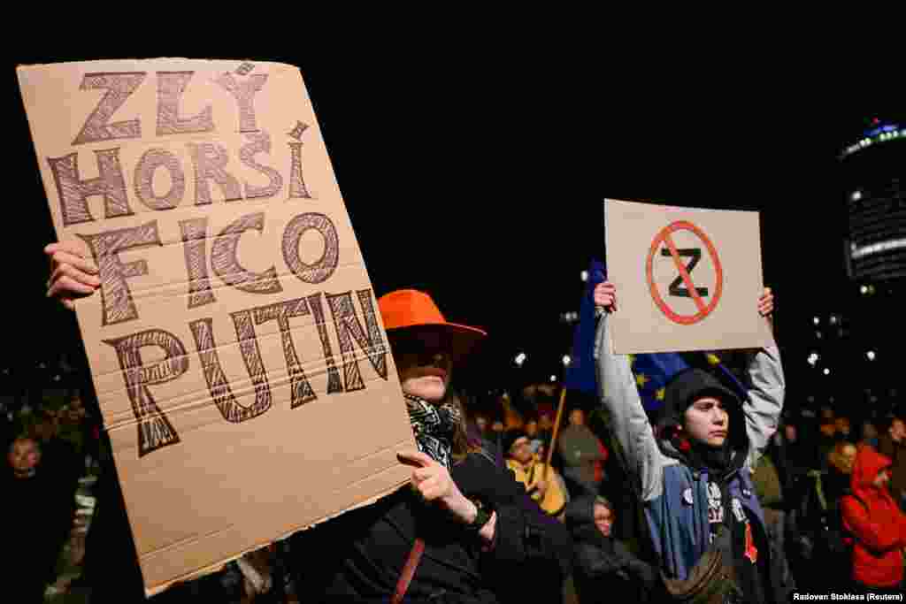 A person holds a sign reading &quot;Bad, Worst, Fico, Putin,&quot; as demonstrators take part in a pro-Ukraine protest against the Slovak government&#39;s foreign policy, after Slovakia&#39;s Foreign Minister Juraj Blanar met with his Russian counterpart, Sergei Lavrov, in Bratislava.