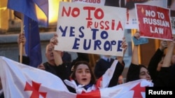 Protesters rally against the draft bill on "foreign agents" in Tbilisi on April 15.