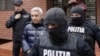 Romania Dan Diaconescu Dan is escorted by police when leaving his home, in Bucharest, April 6, 2023. Inquam Photos / Octav Ganea