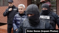 Romania Dan Diaconescu Dan is escorted by police when leaving his home, in Bucharest, April 6, 2023. Inquam Photos / Octav Ganea