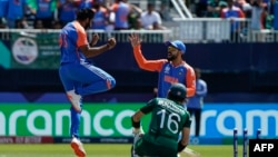 India's Jasprit Bumrah (left) celebrates after dismissing Pakistan's Mohammad Rizwan during their cricket match in New York on June 9.