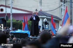 Bagrat Galstanian, a senior church official from Tavush Province, speaks to supporters in Yerevan on May 26.