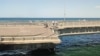 Поврежденный участок дороги после предполагаемого нападения на Крымский (Керченский) мост, который соединяет материковую часть России с Крымским полуостровом через Керченский пролив, 17 июля 2023 года