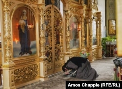 A priest during a service at the St. John the Baptist Cathedral in Comrat.