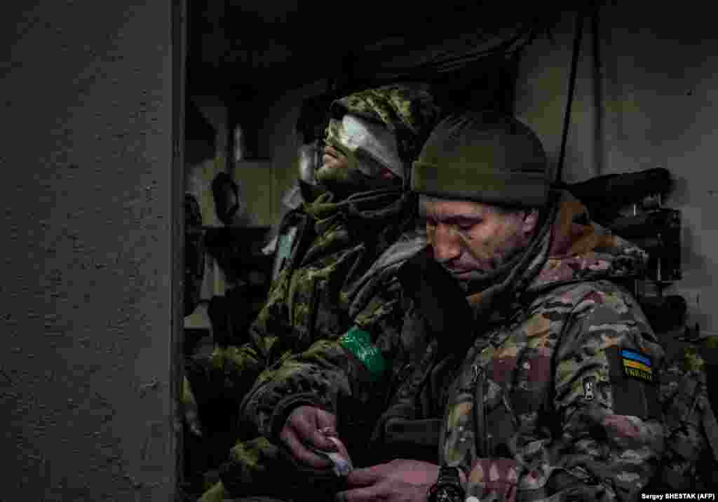 A wounded Ukrainian servicemen sits in an armored personnel carrier as he is evacuated from the front line near Bakhmut on March 8.