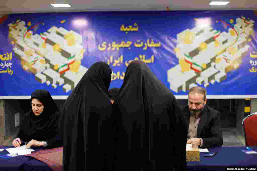 Iranians cast their vote at the Iranian Embassy in Baghdad. A candidate needs to win at least 50 percent of the votes to win the race. A potential run-off election has been scheduled for July 5.