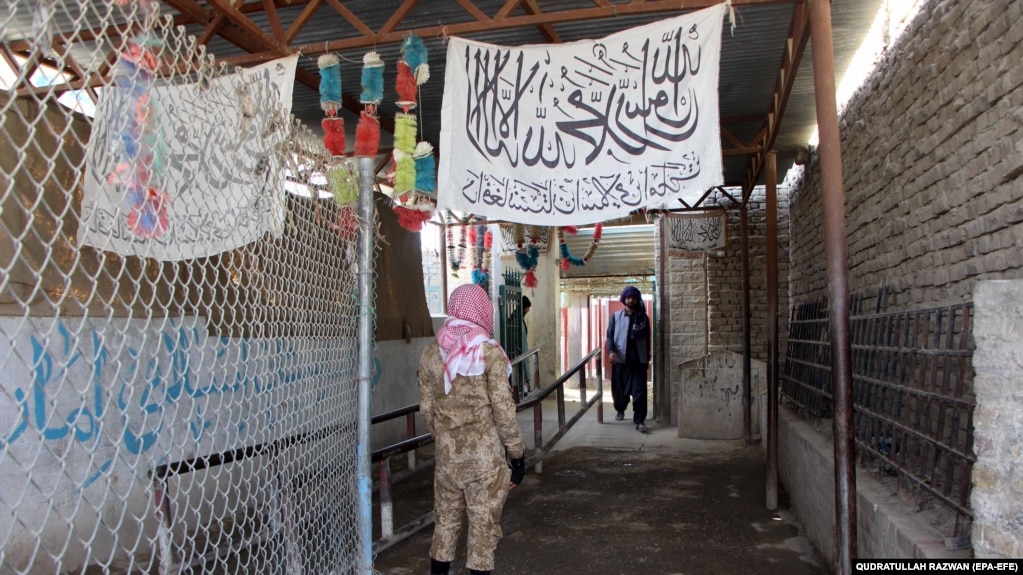 A Taliban fighter stands guard at the Spin Boldak border crossing connecting southern Afghanistan and southwestern Pakistan.