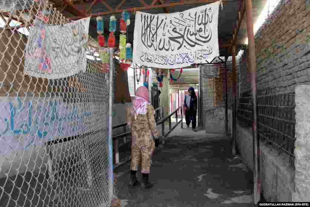 A Taliban security officer stands guard at the Spin Boldak border crossing on July 22. Pashtun communities on both sides of the boundary argued that the border closing harmed their livelihoods and caused significant financial losses.&nbsp; &nbsp;