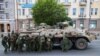 Armed men alongside an armored vehicle in the center of Rostov-on-Don. The photo was made on the morning of June 24, near Russia&#39;s southern military district headquarters.&nbsp;