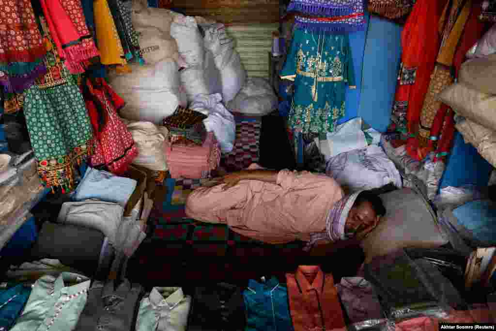 With few people venturing out on the streets, vendors took naps in their shops.
