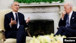 U.S. President Joe Biden (right) meets with NATO Secretary-General Jens Stoltenberg in the Oval Office at the White House in Washington on June 13.