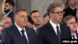 Serbian President Aleksandar Vucic (right) and the president of Republika Srpska, Milorad Dodik, at the All-Serbian Assembly in Belgrade on June 8.
