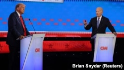 Дональд Трамп и Джо Байден во время дебатов