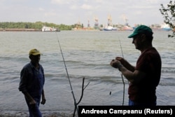 Two men prepare to fish across the Danube from the port of Izmayil on September 5.