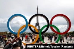 Olympic rings to celebrate the IOC official announcement that Paris had won the 2024 Olympic bid are seen in front of the Eiffel Tower on Trocadero Square in Paris in September 2017.