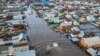 A drone view shows a truck driving along the flooded street in the settlement of Zarechnoye, Orenburg region, Russia, on April 11.