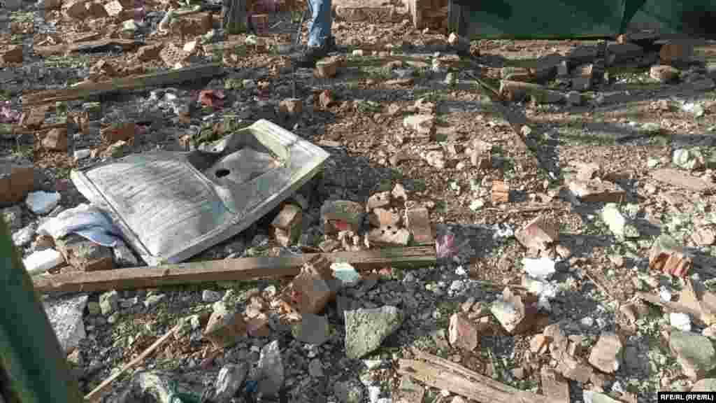 A person walks through the rubble near a residential area that was damaged during the missile strike. &nbsp;
